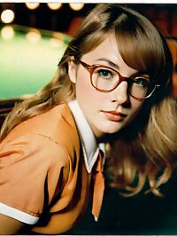 In the opulent art deco theater a stunning woman stands out