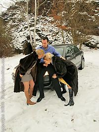 Hot blonde babes wearing fur sucking cock outside in snow