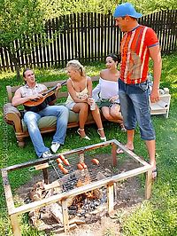 Large group of people having groupsex during outdoor BBQ