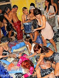 Insane partygoers sucking and fucking in a foamy group sex