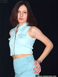 Cute Russian teen girl takes her nice jeans dress off