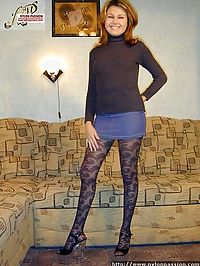 Leggy Blondie in black nylon pantyhose exhibiting herself on sofa