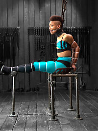 Defiled - Nikki Darling : Ebony stunner Nikki Darling is intense. She is an active and performing dancer and has the physique of a sleek panther in its prime. In scene one, she is given a perch. Sitting on an uncomfortable vintage metal tractor seat that is transformed into a mini throne, her whole body is zip tied together. Her elbows touch as vicious and inescapable hard plastic bites into her flesh all the way down to her feet... her lovely tender soles. Claire clips off the last zip tie, taking Nikkis shoes off and creates a uncomfortable predicament for Nikki that the cunt wont soon forget involving nipple clamps, wax, the cane, nipple weights, and twine from each of Nikkis big toes to her nipple clamps. In scene two, the panther is on the prowl. She is positioned in a low crouching doggy in metal and leather, and made to look like a panther ready to strike. The greedy whore cums from pain and Claire obliges her by using the single tail and a really stingy rubber flogger. With her amazing ass displayed in the air, a nice thick cock is rammed to the hilt into her more than willing ass hole. Orgasm after orgasms, she moans and writhes. Finally we test this bitch and push her to the max in endurance flexibility bondage. A cruel forward bend strappado suspension in leather. Claire goes after her feet with the cane, introduces harsh clamps to Nikkis labia and a nice anal hook to the booty. Orgasms are ripped from this helpless cunts body. So hot. So helpless.