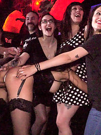 Underground Goth Club turns into a Wild Fuck Party! : Part 1 - Spanish Slut Fucked OutdoorsFrida Sante is a gorgeous Spanish slut who loves to take it hard for all to see. Fully outdoors in front of a crowd she gets fucked, spanked, and put to work on the cock! This gorgeous slut can really take it from all ends while strangers gasp at the hard face fucking happening right before their eyes! This scene ends up being soo hot for Frida in her tight black dress, stockings and latex garter that she needs to take a public dip in the local fountain!Part 2 - Underground Goth Club turns into a wild fuck party!Steve Holmes drags Frida Sante to a crowded underground goth club, where the patrons are ready and horny for all the action they can get! The sexy goth sluts at this club take turns flogging Fridas perfectly round ass before making her crawl on her hands and knees to sniff every hot piece of ass in the joint. Unable to control herself one of the smoking hot petite whores strips naked and goes in for some lesbian pussy licking and face sitting. As the night goes on the whole bar gets their tits out and joins in the wild party. Frida needs to be tied up in tight rope bondage to be fucked with an anal plug while the audience gets flogged before a huge cum shot cock sucking for everyone to enjoy.